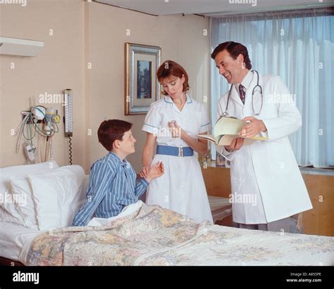 Young Nurse and Boy in Hospital .